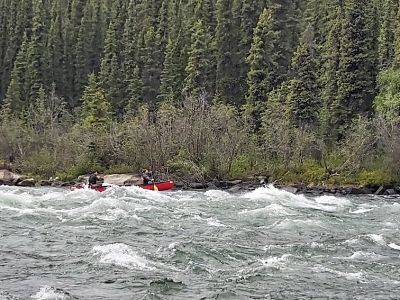 Two canoers in the big rapid section of the Jaws of Death