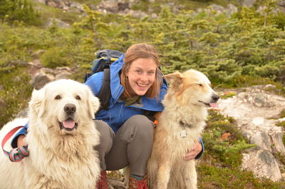 Photo of a weary adventurer and two goofy pups