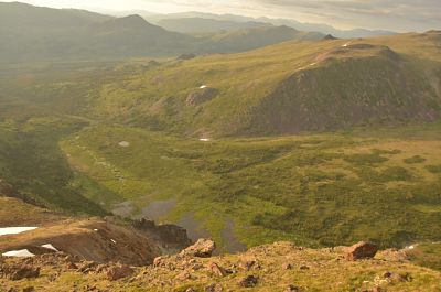 Photo of green valley in the evening sun